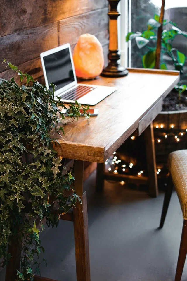 A laptop sitting on a desk in an office-like setting. intende to empasize the kind of work Nerdy Income does as described in the About Us page